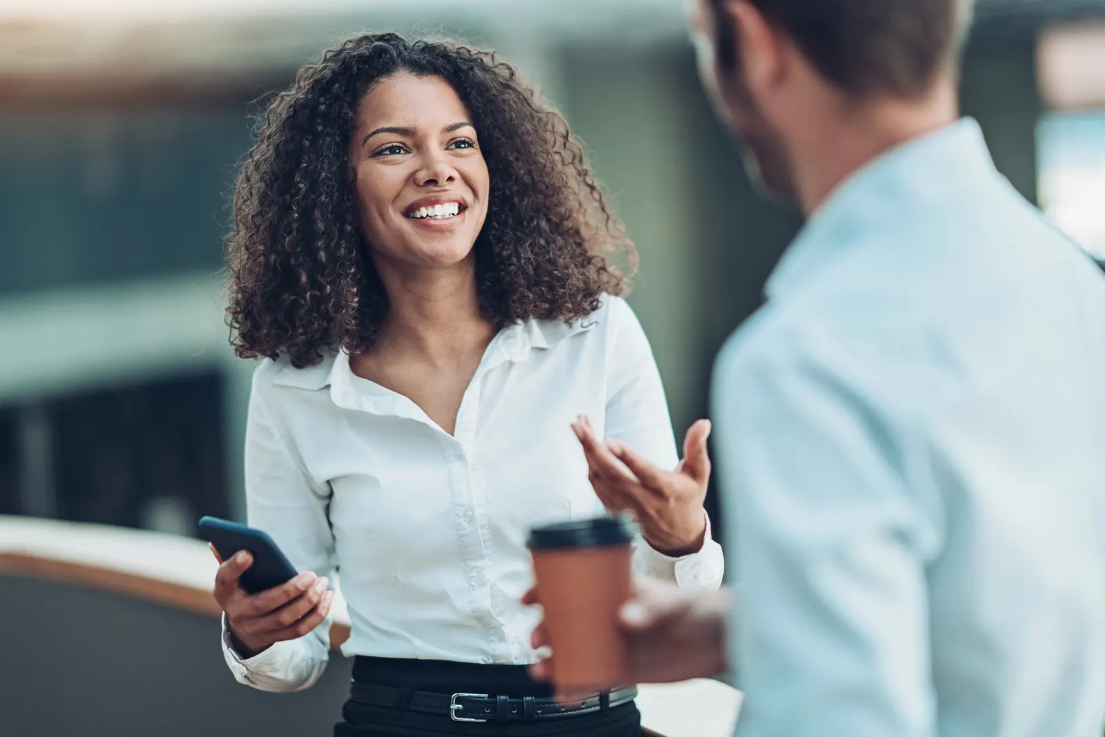 An informal conversation between professionals in a workplace